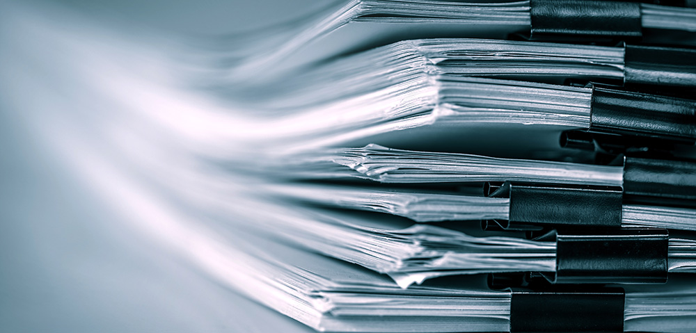 Stacks of paper clipped together into booklet..